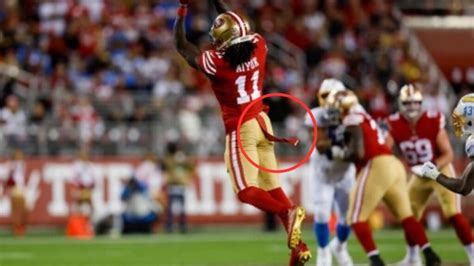 What is the Strap Hanging from Football Players' Back? And Why Does It Seem to Have a Mind of Its Own?